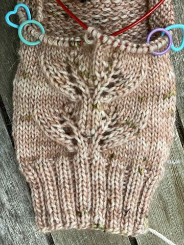 The heel of a handknitted sock in the process of being knitted