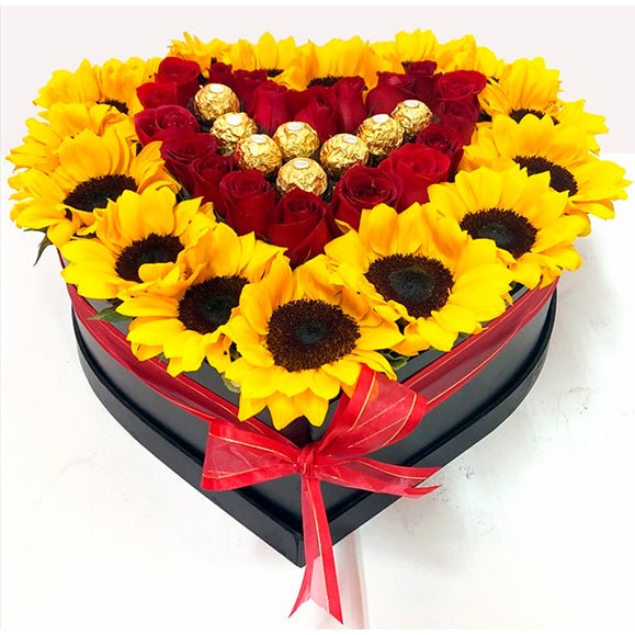 arreglo floral en forma de corazón con girasoles naturales de exportación y  chocolates