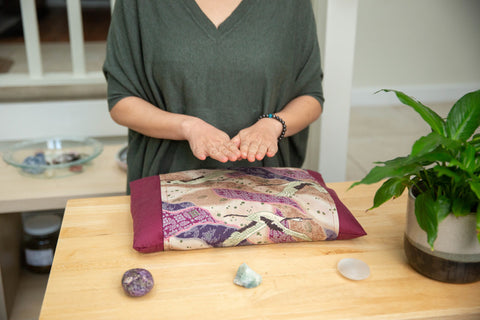 Asian woman giving distance reiki