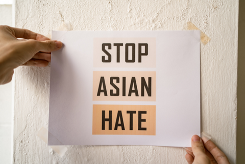 photo against wall stop asian hate