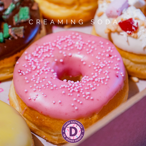 Our Creaming Soda Donut that is part of the Backyard Favourite Flavours box and is topped with raspberry glaze with sprinkles and a touch of fizz.