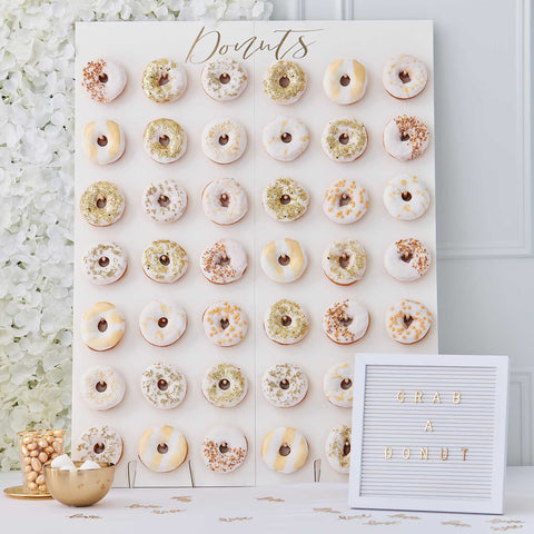 The Glitz and Glam donut wall holds 42 donuts. The white backing with "doniuts" wording makes a great canvas for your choice of donuts and can be styled around your theme. 