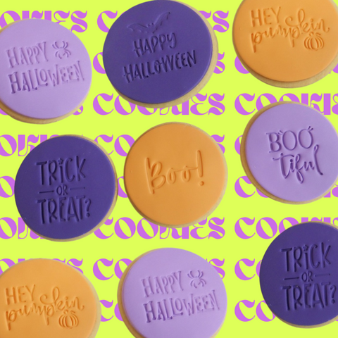 This image feature the three designs of our Halloween cookies available for delivery across Sydney and Melbourne. 9 shortbread cookies can be seen in the image. Light purple fondant topping that says Happy Halloween. Dark purple fondant topping that says Happy Halloween and another that says Trick Or Treat. Orange fondant topping that says Boo and another that says Hey Pumpkin.