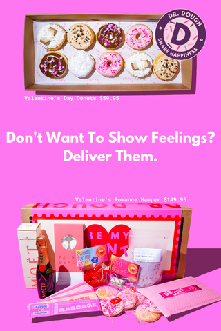 A blank pink background. At the top a box of Dr. Dough Valentine's Day donuts featuring 10 delicious decorated donuts. Underneath is a Dr. Dough Valentines Hamper with Moet, Palm Beach candles, bathsalts, candy, love dice and Valentine's cookies presented in a Be My Valentine box.