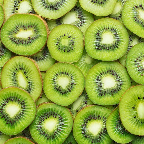 Close-up of sliced Kiwi fruit revealing juicy interior and seeds