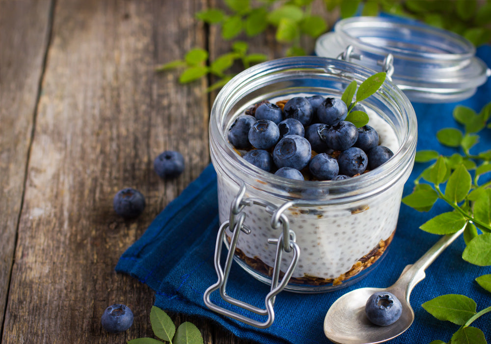 blueberries and granola with milk