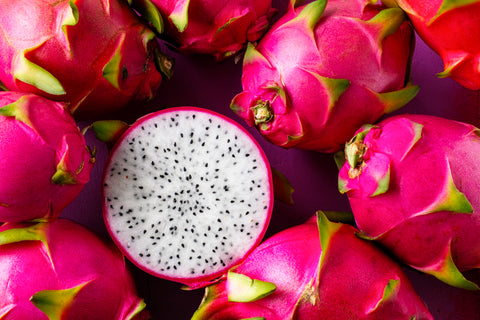 “Vibrant dragon fruits showcasing their contrasting white, seed-speckled interior