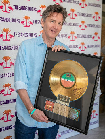 Andrew McCarthy holding St Elmos Fire RIAA Gold Award