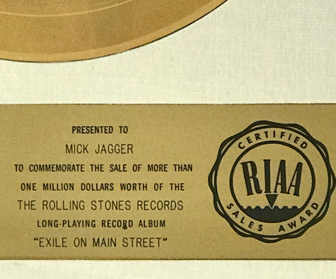 White matte RIAA award presented to Mick Jagger of the Rolling Stones