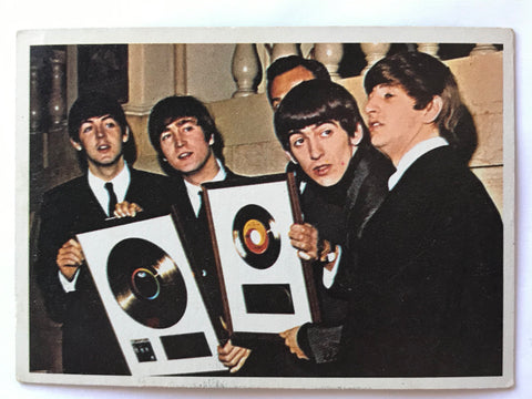 Beatles with RIAA Gold Records on collector card