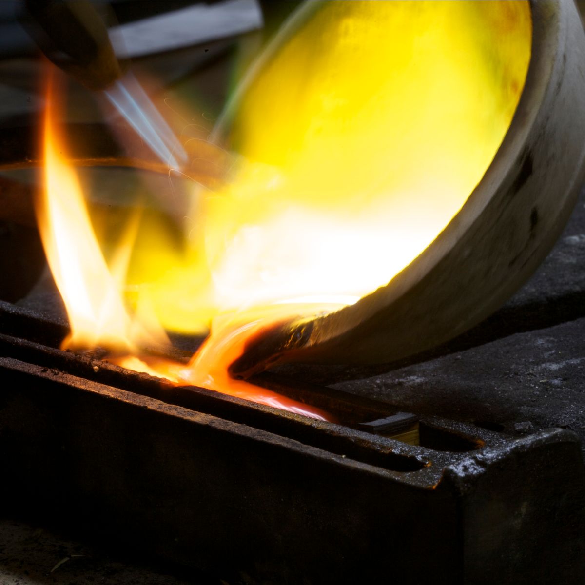 Melting gold and pouring into ingot mould.