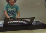 kid playing piano