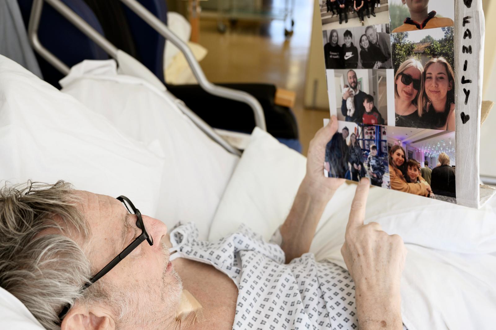 Michael Rosen in intensive care looking over family photos