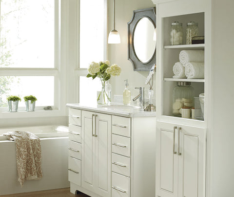 white traditional bathroom vanity and linen cabinet