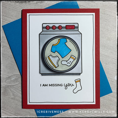 A handmade card designed to send to a friend or family member who you've been missing! Front and center is a stamped and die-cut washing machine that's been hand colored. The center portion of the washing machine that resembles the drum is elevated off of the card base with a small plastic spring so that it moves back and forth when flicked. The sentiment "I am missing you" is accented by a lonely sad sock. The red card base coordinates nicely with the bright blue envelope that's included. 