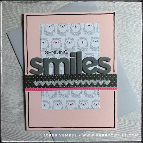 Sending smiles is the sentiment on this card front and it's a combination of stamping and die-cut letters from foam. A background panel of smiling hedgehogs reinforces the theme. Three horizontal strips, including one of tiny metallic sparkly hearts run parallel to the sentiment. Hand drawn lines outline the perimeter of the pale pink card base. A light grey envelope is included. 
