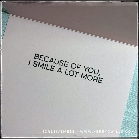 The inside of the card features the sentiment "Because of you, I smile a lot more" stamped in black ink against the pale pink card base. 