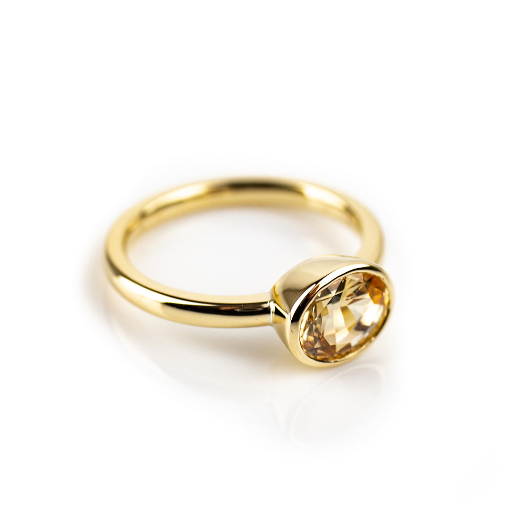 Yellow sapphire bezel set ring in yellow gold by Tamahra Prowse