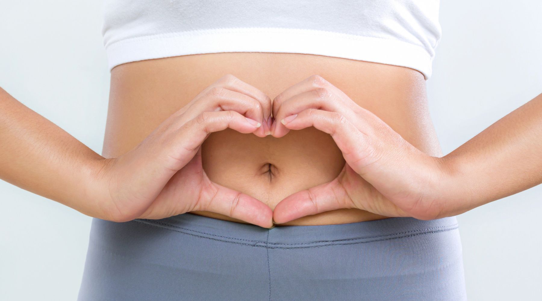 Collombatti Naturals 8 reasons to love chai this winter blog - a photo of a female torso with hands shaped like  heart in front of her belly button