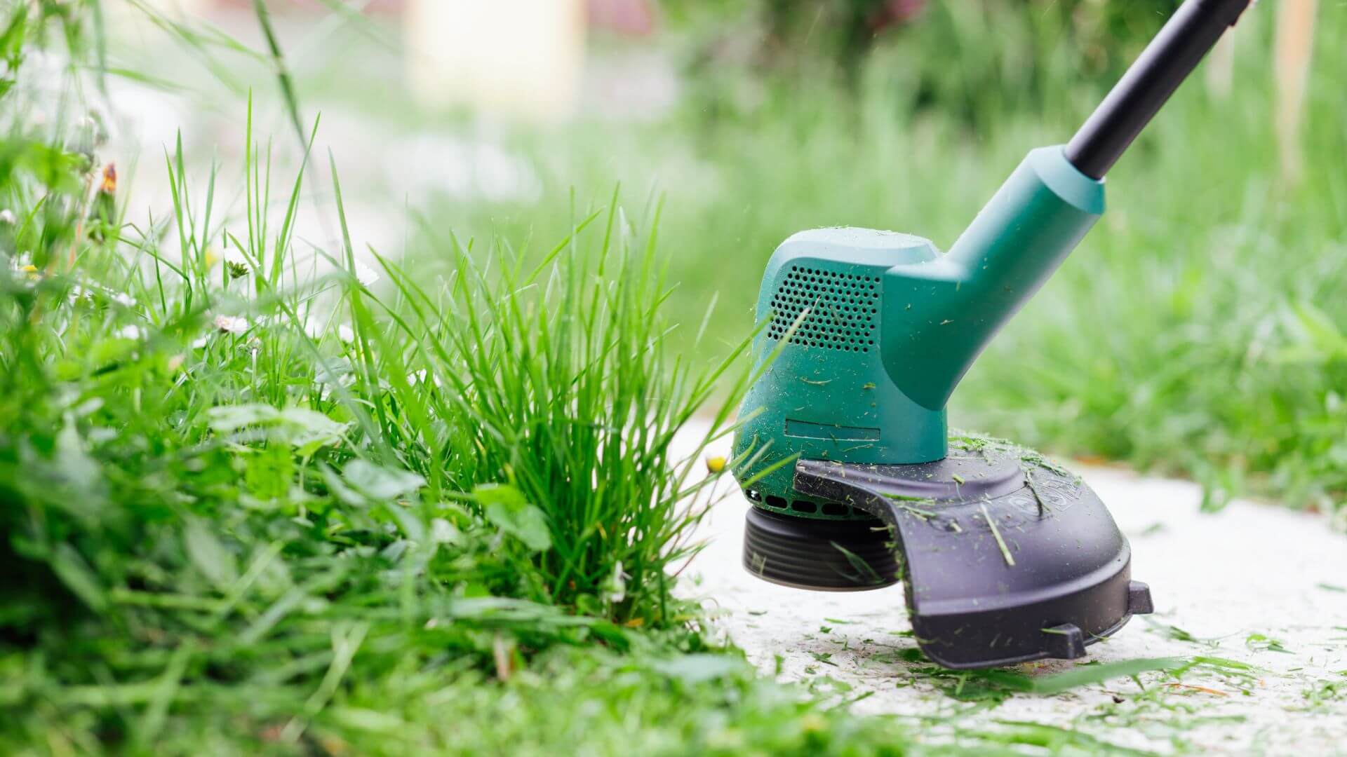 Collombatti Naturals handmade and sustainable christmas gifts picture of someone usuing a whipper snipper to trim the grass