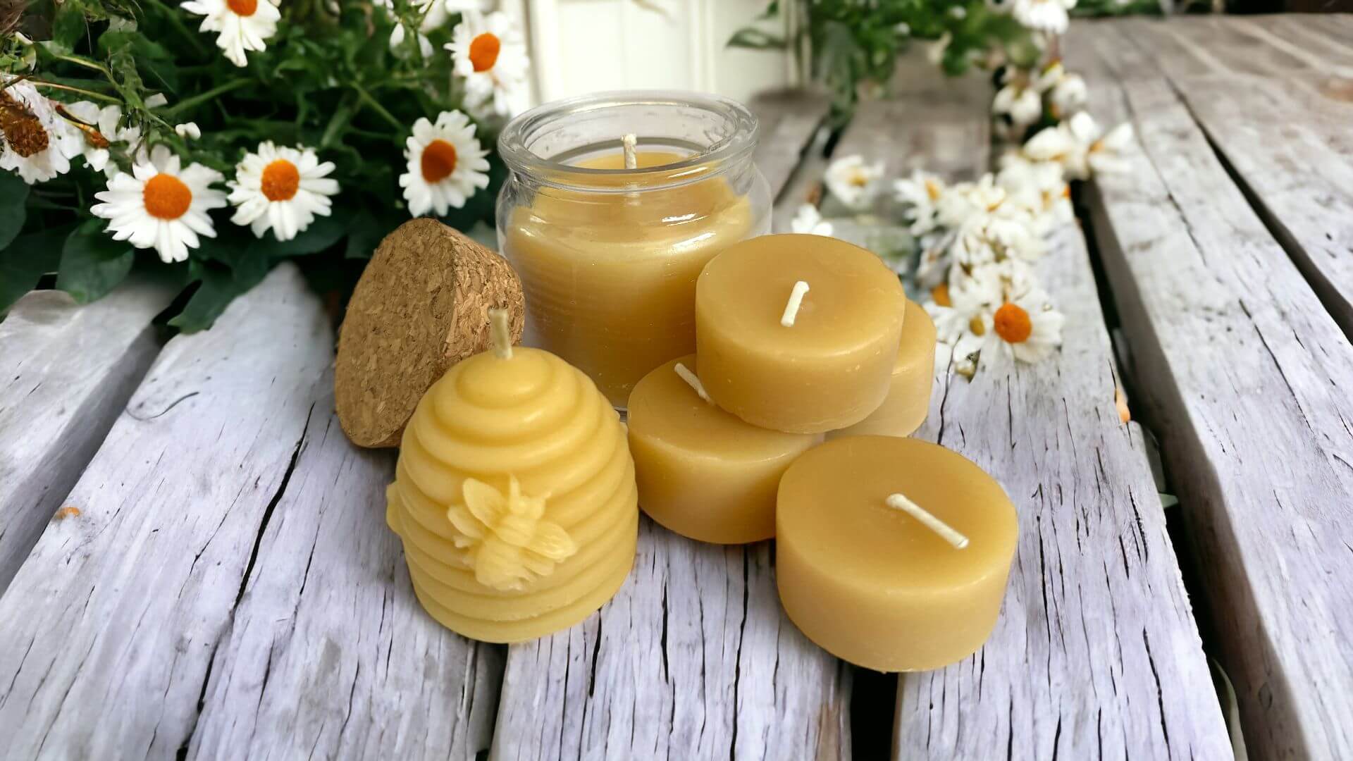 Collombatti Naturals Handmade and ecofriendly christmas gift with a photo of handmade beeswax candles of various shapes on a wooden table