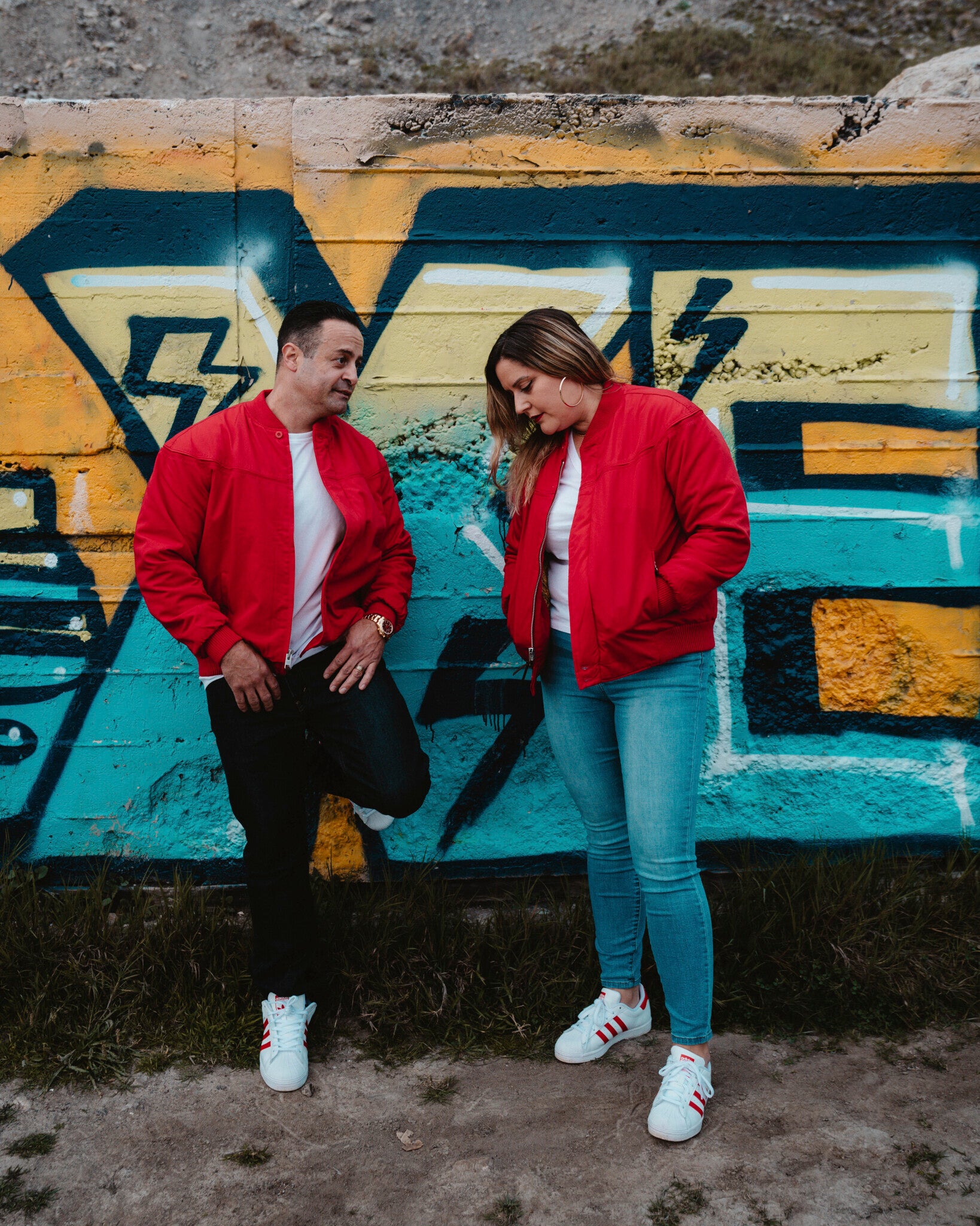 man and woman wearing a classic red derby jacket