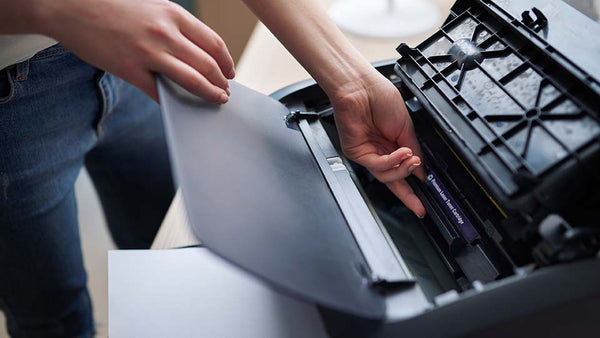 toner cartridge being replaced