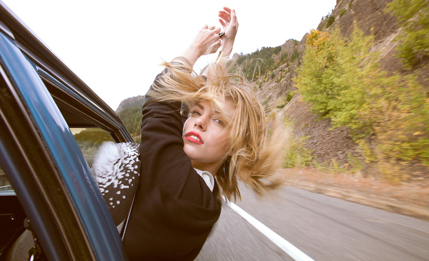 Girl with her hair blowing in the wind.