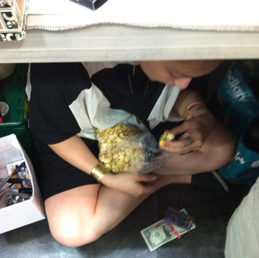 Don't mind me. Just taking a little break under the table and eating some of the tasty kettle corn being sold at the event. 