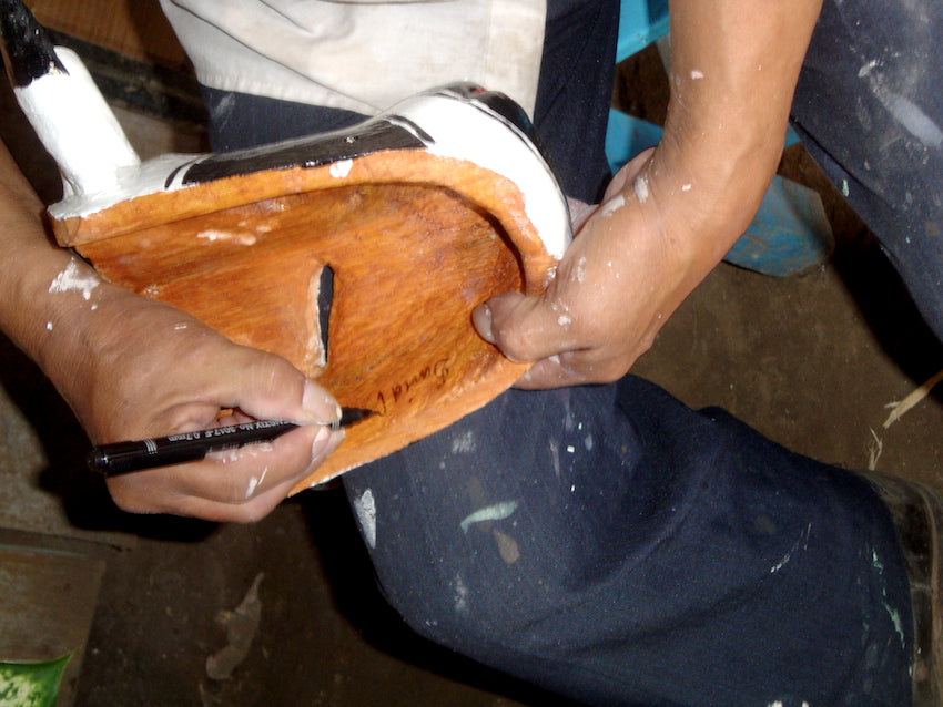 The working hands of a master tradition wooden mask maker in Veracruz.