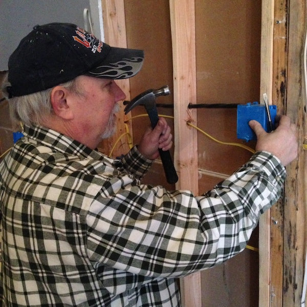 crew member installing wiring