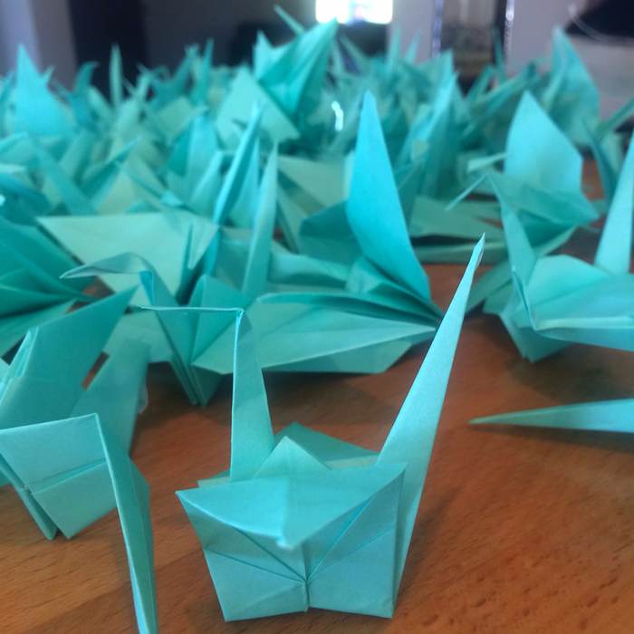 Tons of origami cranes we're making for a friend's wedding.