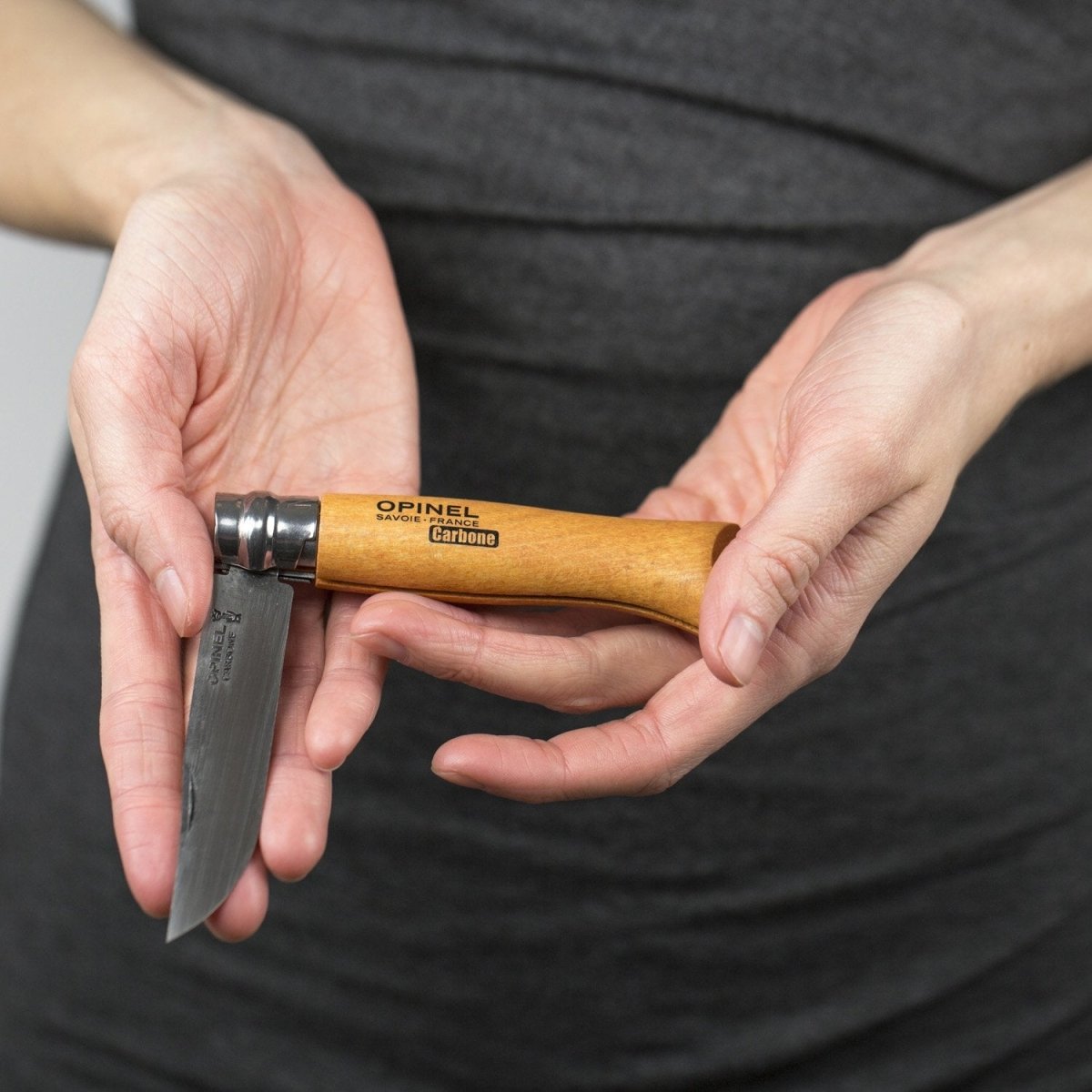 https://cdn.shopify.com/s/files/1/0060/6162/products/opinel_knife_in_hands-721919_1200x.jpg?v=1702472593