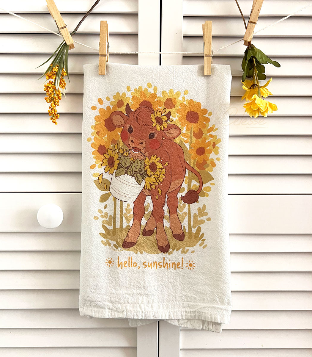 https://cdn.shopify.com/s/files/1/0060/6692/files/hello-sunshine-sunflower-cow-flour-sack-tea-towel.jpg?v=1691001833&width=1100