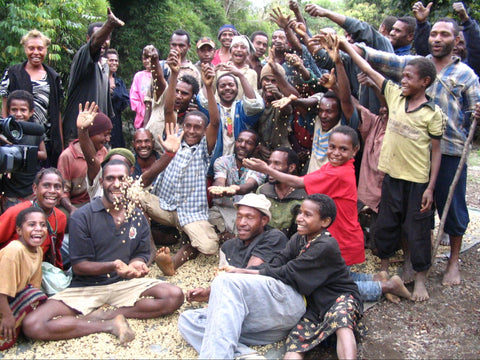Farmers celebrating with green coffee in Papua New Guinea