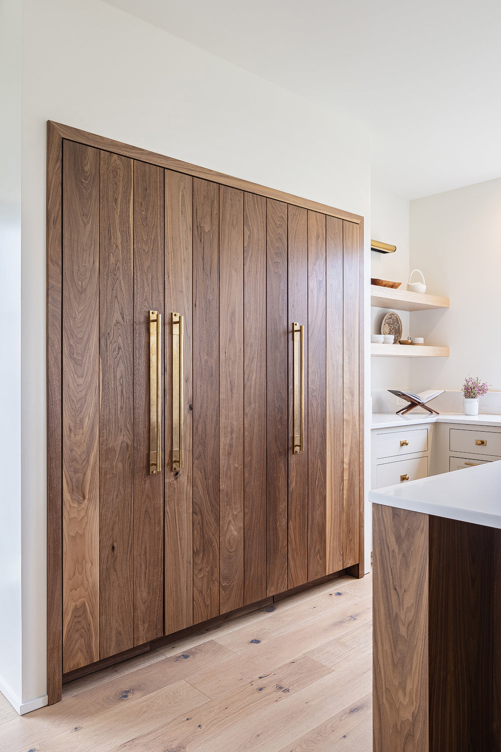 Walnut kitchen cabinetry by Edgework Creative