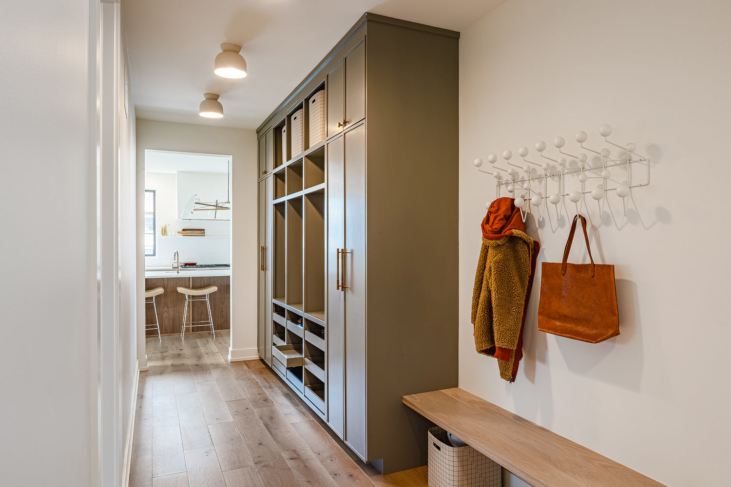 Mudroom cabinetry and storage by Edgework Creative