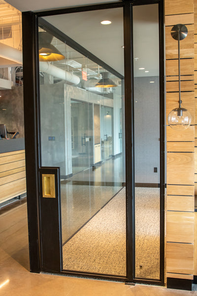 Metal and glass office doors by Edgework Creative