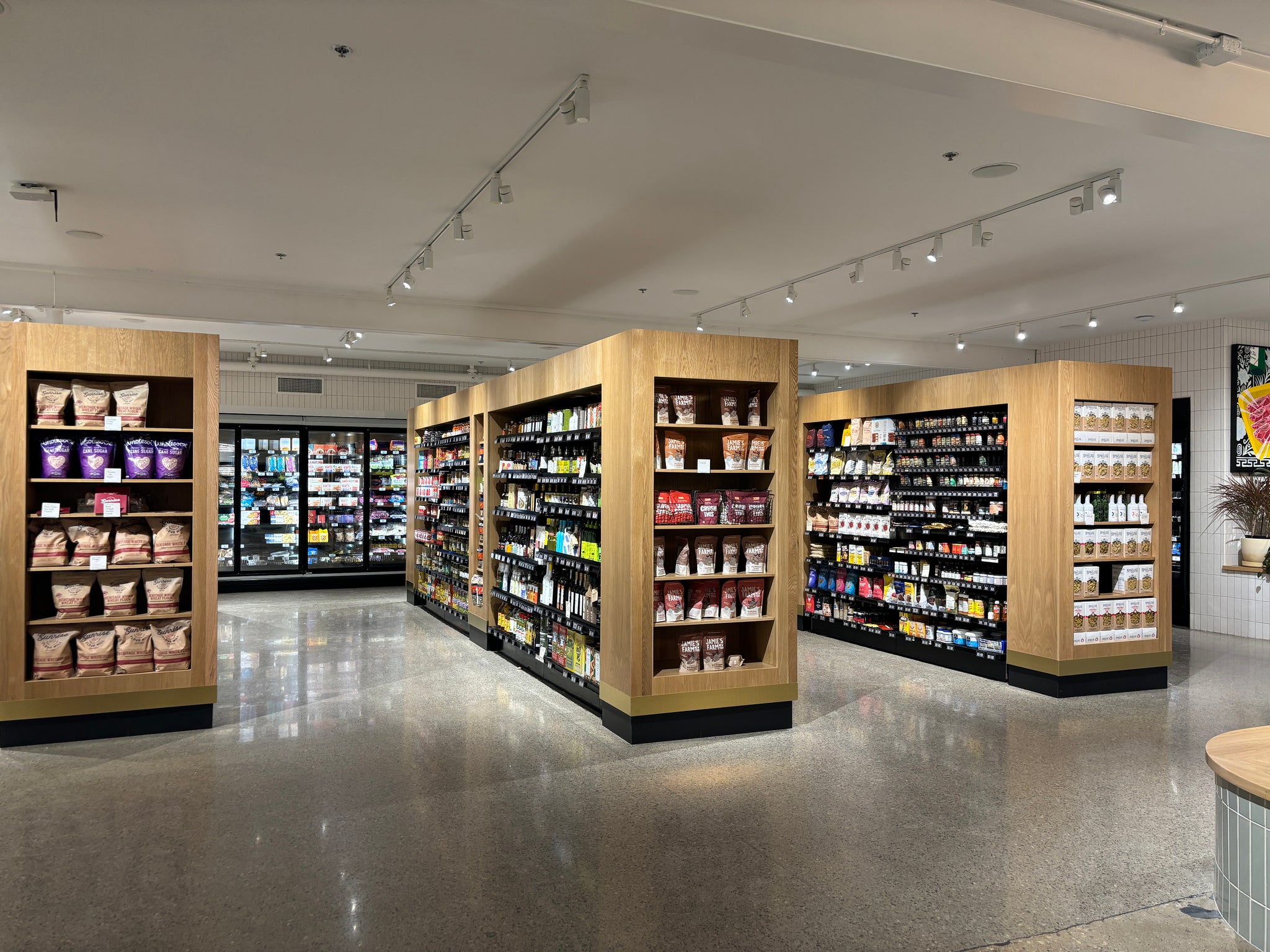 Grocery market display shelving by Edgework Creative