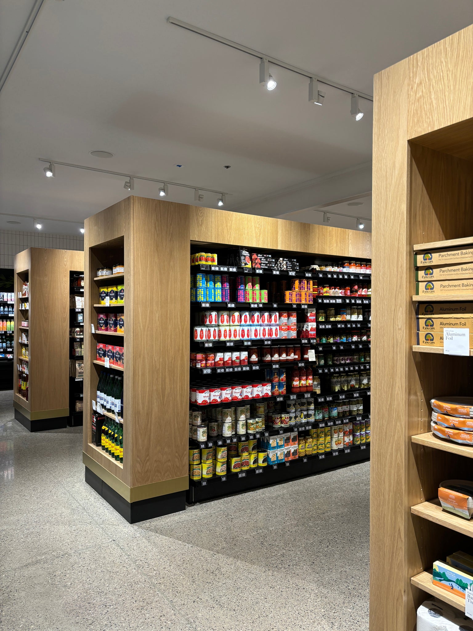 Wood grocery shelving by Edgework Creative