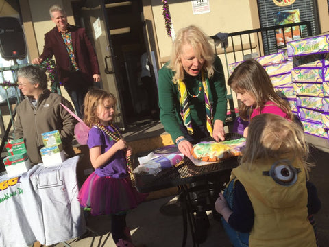 Peggy Scott Laborde cuts the first piece of King Cake at Pizza Nola's Carnival Kickoff, 2016