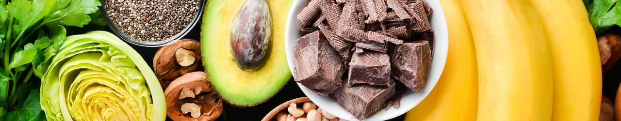 Magnesium food sources: Avocado, nuts, seeds, and leafy greens.