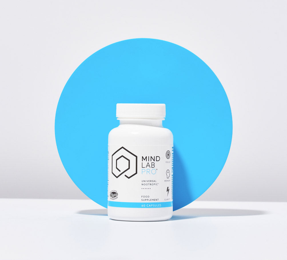 Bottle of Mind Lab Pro supplements in front of a blue dot