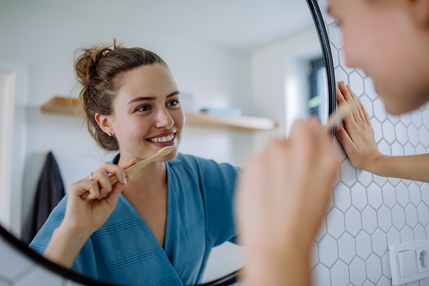 A Woman Brushing Her Teeth With Bamboo Toothbrush