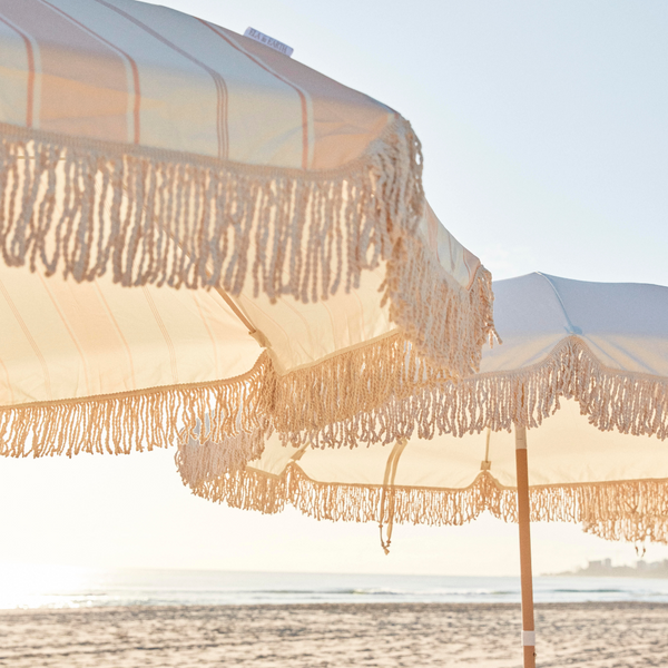 Fringed beach umbrellas made with recycled fabric
