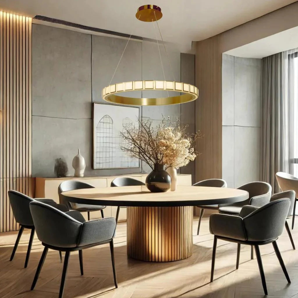 Modern gold round pendant over dining table