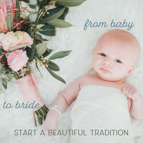 tiny baby wearing a pearl bracelet lying next to a wedding bouquet - from baby to bride, start a beautiful tradition.