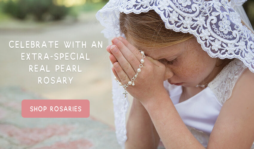 Catholic Girl with a real pearl and sterling silver rosary praying.