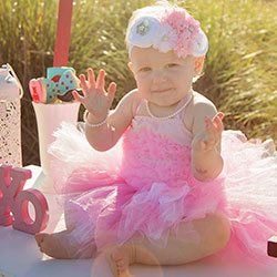 Baby Girl in a pink tutu celebrating Valentine's Day with a pearl bracelet and necklace set from Little Girl's Pearls.