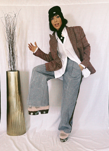 model wearing an L2R the Label blazer, a gold metallic brami over EMBROIDERED WIDE COLLAR SHIRT IN WHITE COTTON, and a wide-leg cargo pants in grey with embellishments